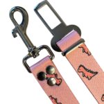 cinturon de seguridad dino rosa