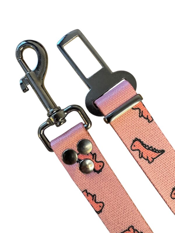 cinturon de seguridad dino rosa